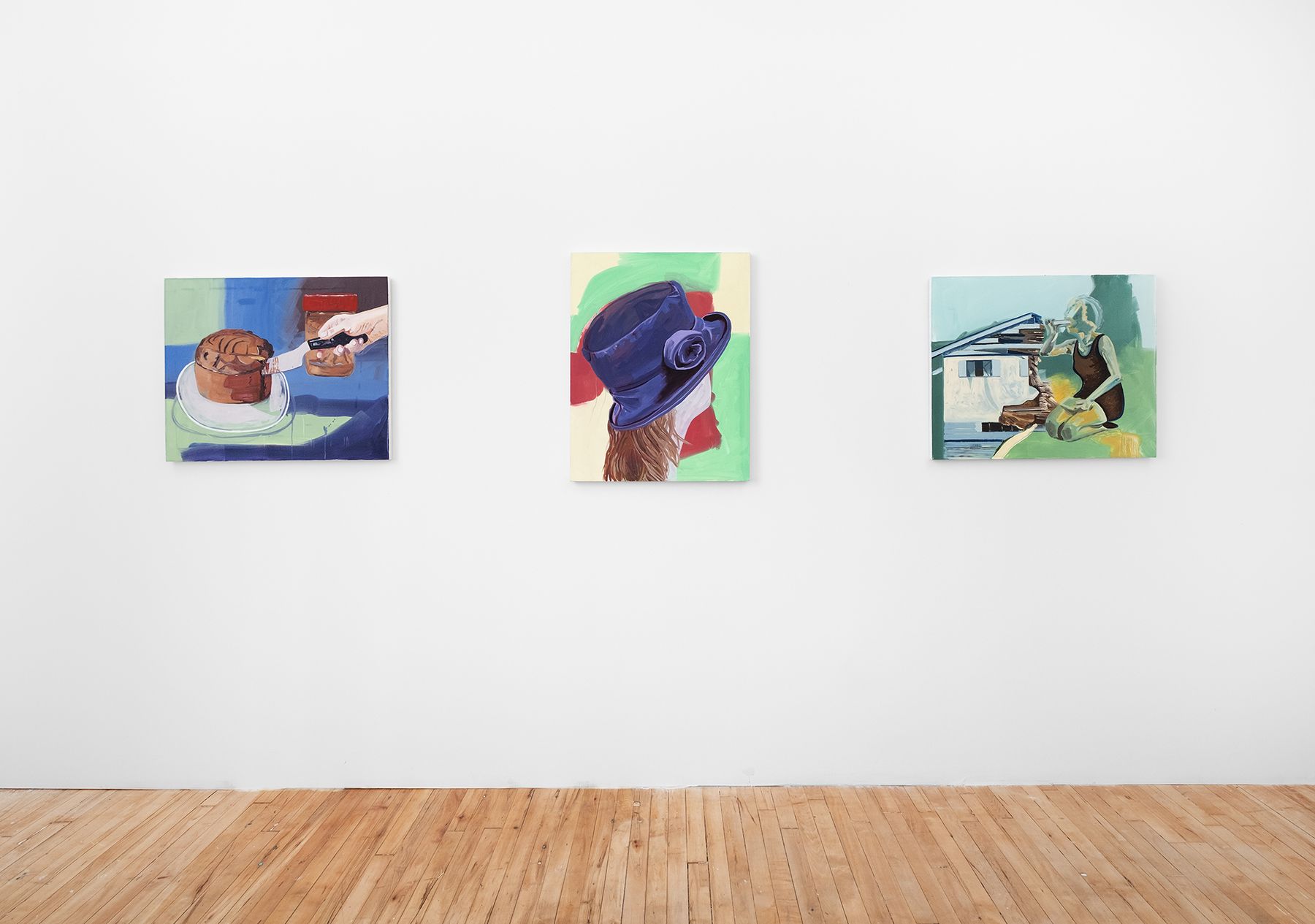 Installation view of three paintings by Madeline Bohrer on a gallery wall